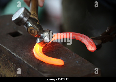 Sheung Shui, China, horseshoe is forged Stock Photo