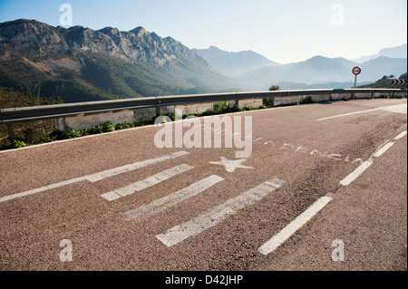 The word 'Independencia' - Independence and a symbolized Valencian or Catalan Flag are painted on road in Spain Stock Photo