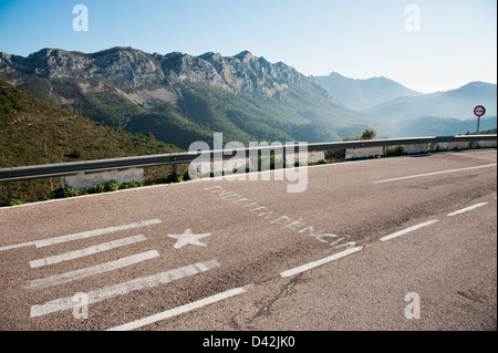 The word 'Independencia' - Independence and a symbolized Valencian or Catalan Flag are painted on road in Spain Stock Photo