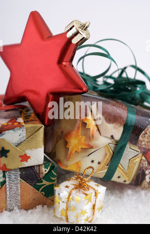Berlin, Germany, Christmas presents on a bed of artificial snow Stock Photo