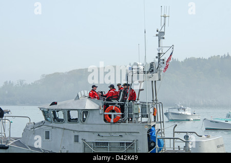 Coast Guard crew members prepare for a Memorial Day ceremony in Bar Harbor, Maine Stock Photo