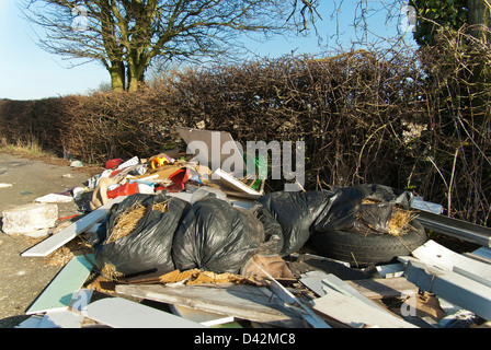 Fly tipped household rubbish in a green lane / bridleway, South Yorkshire, England. Stock Photo