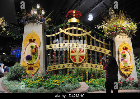 Philadelphia, PA, USA. March 1, 2013. The Philadelphia Flower Show, the largest indoor flower show in the world, opened to the public on March 2, 2013 at the Pennsylvania Convention Center in Philadelphia, Pa. This year's theme, 'Brilliant,' celebrates Great Britain's landscapes and cultural icons. Visitors walk into the show through massive gates made of flowers surmounted by a crown. The flower show is produced by the Pennsylvania Horticultural Society. The first show was held in 1829. This year's show runs through March 10. (Photo: Terese Loeb Kreuzer/Alamy Live News) Stock Photo