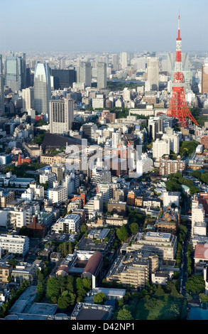 Daytime aerial view of metropolitan downtown Tokyo city skyline with high-rise buildings including Tokyo Tower. Stock Photo