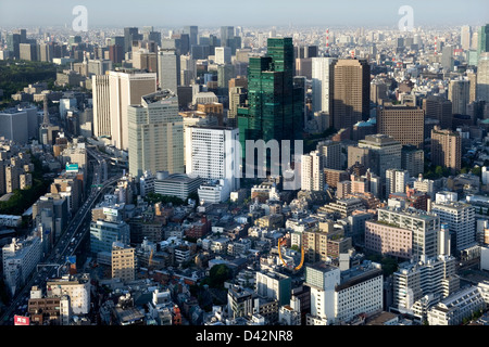 Daytime aerial view of metropolitan downtown Tokyo city skyline with high-rise buildings including green Izumi Garden Tower. Stock Photo