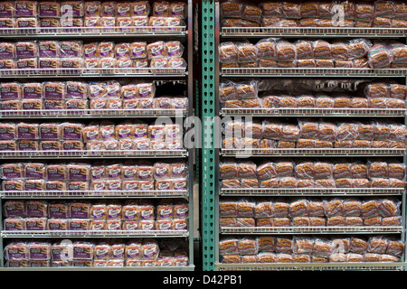 Pepperidge Farm whole grain and Nature's Own honey wheat bread on display at a Costco Wholesale Warehouse Club. Stock Photo