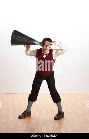 Freiburg, Germany, a man listens through a megaphone Stock Photo