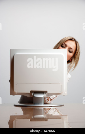 Freiburg, Germany, a young woman a little perplexed at the computer Stock Photo