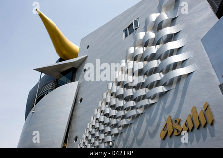 Unique gold flame sculpture, or Flamme d'Or, at Asahi Super Dry Beer Hall designed by French architect Philippe Starck. Stock Photo