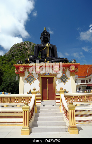 Big sacred black Buddha on sunny day. Stock Photo