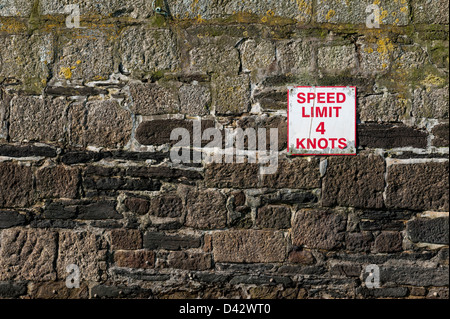 A speed limit sign on the quay wall in Newquay Harbour. Stock Photo
