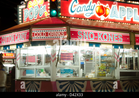 A brightly lit food stall glows after dark at the Blue Hill Fair, Maine Stock Photo