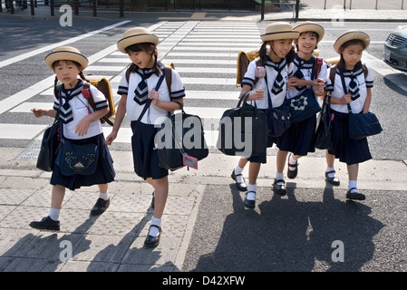 Japanese school girls walking in Shinjuku Tokyo Stock Photo - Alamy