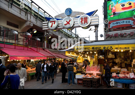 Ameyoko-cho, former black market under railway in Okachimachi Tokyo, is a thriving food and merchandise marketplace for bargains Stock Photo