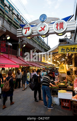 Ameyoko-cho, former black market under railway in Okachimachi Tokyo, is a thriving food and merchandise marketplace for bargains Stock Photo