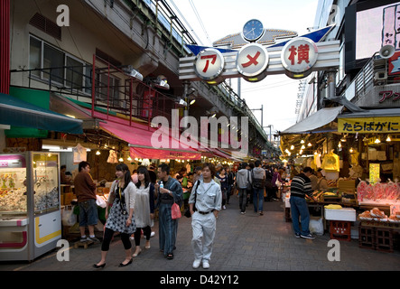 Ameyoko-cho, former black market under railway in Okachimachi Tokyo, is a thriving food and merchandise marketplace for bargains Stock Photo