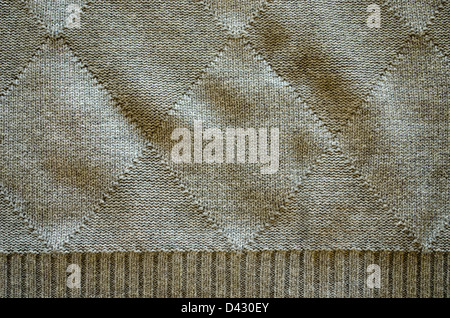 knitted wool pattern rhomb form and line grey color background closeup. Stock Photo