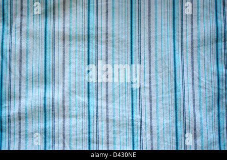 crumple fabric with blue and gray lines on white background closeup. Stock Photo