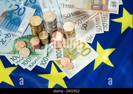 Hamburg, Germany, Euro notes and Euromuenzen on a European flag Stock Photo