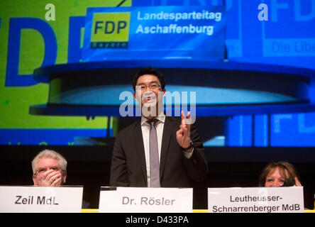 Chairman of the German Free Democratic Party, FDP Philipp Roesler smiles next to Bavarian Economy Minister Martin Zeil (R) and FDP state chairwoman Sabine Leutheusser-Schnarrenberger at the Regional FDP Party Conference in Aschaffenburg, Germany, 03 March 2013. Photo: FRANK RUMPENHORST Stock Photo