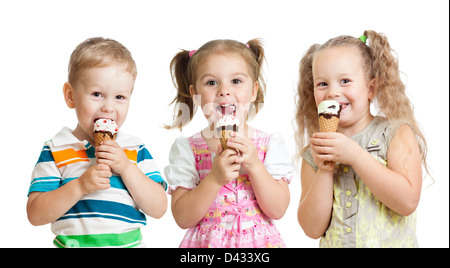 happy children boy and girls eating ice cream in studio isolated Stock Photo
