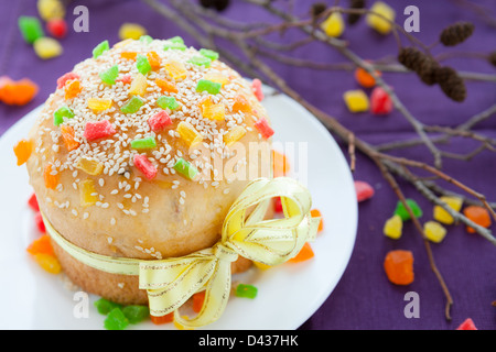 Easter cake decorated with a yellow ribbon, sweets closeup Stock Photo