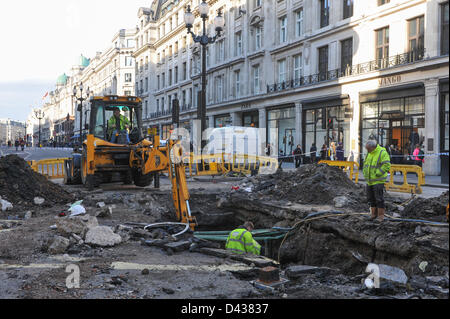 Regent Street, London, UK. 3rd March 2013. Workmen and machinery at the site of the burst water main on Regent Street. The burst water main on Regent Street at the junction with Vigo Street is being repaired, Regent Street is still closed to traffic from Conduit Street to Piccadilly Circus. Credit: Matthew Chattle/Alamy Live News Stock Photo