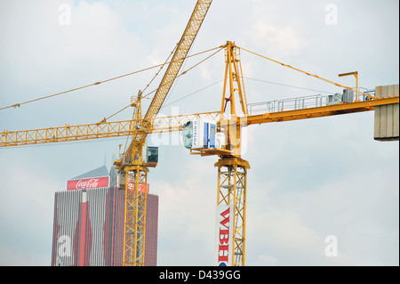 A view up at two large cranes working in Johannesburg city center. Stock Photo