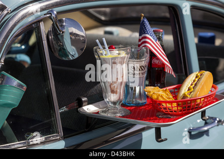 Car hop tray hung on the window of a classic car closeup Stock Photo