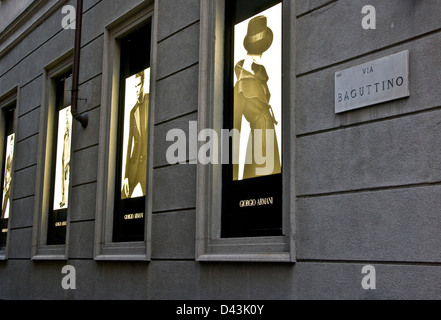 Line of Illuminated Giorgio Armani clothes fashion adverts Via Baguttino Milan Lombardy Italy Europe Stock Photo