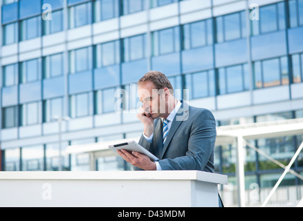 Businessman using Tablet PC, Niederrad, Frankfurt, Germany Stock Photo
