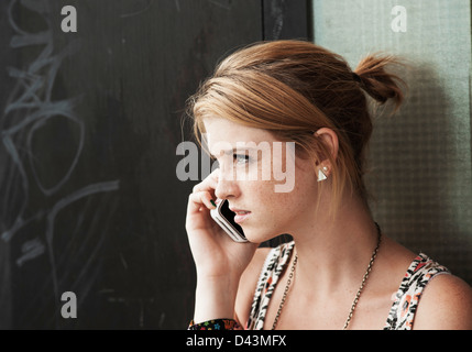 Teenager using Cell Phone, Mannheim, Baden-Wurttemberg, Germany Stock Photo