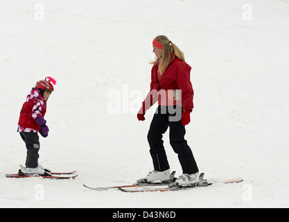 Children practice their form at ski school Stock Photo