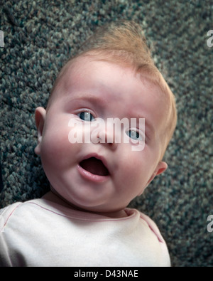 newborn infant baby looking at camera Stock Photo