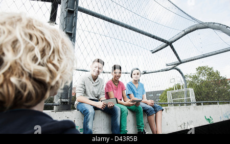Three Boys and One Girl in Playground, Mannheim, Baden-Wurttemberg, Germany Stock Photo