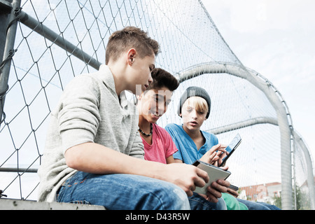 Boys with Tablets and Video Games in Playground, Mannheim, Baden-Wurttemberg, Germany Stock Photo