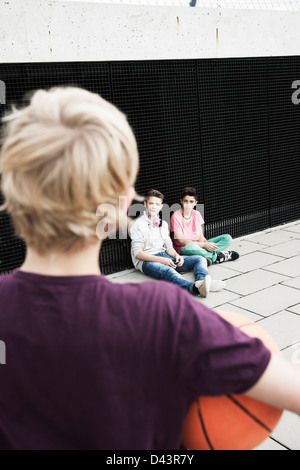 Boys Hanging Out in Playground, Mannheim, Baden-Wurttemberg, Germany Stock Photo