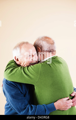 Senior Men Hugging Stock Photo