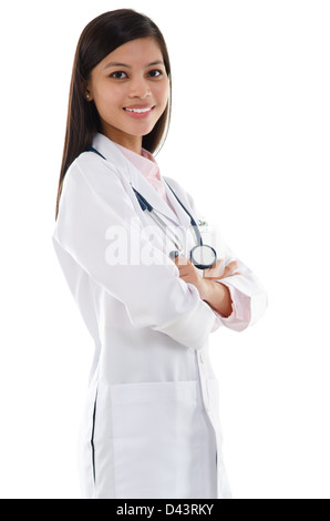 Confident Southeast Asian female medical doctor standing isolated on white background. Stock Photo