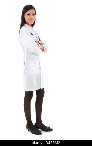 Full body Southeast Asian female medical doctor standing isolated on white background. Stock Photo