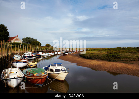 Boats moored at Blakeney Quay in North Norfolk, UK Stock Photo