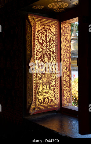 Window in a temple in Luang Prabang Stock Photo