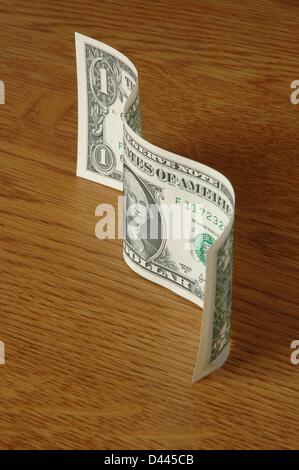 Illustration - View of a curled dollar bill in Berlin, Germany, 5 December 2007. Fotoarchiv für ZeitgeschichteS. Steinach Stock Photo