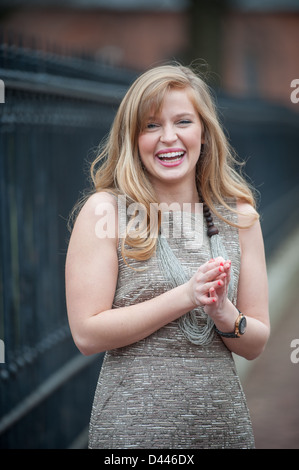 Young blond woman laughing and smiling Stock Photo