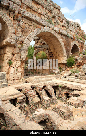 Ruins of ancient public Roman baths in Perge, Antalya, Turkey Stock Photo