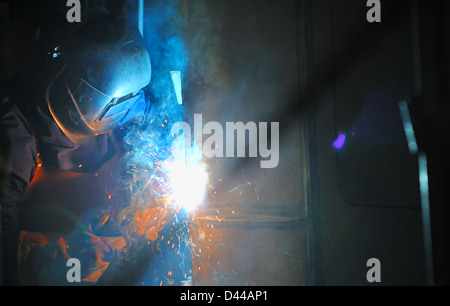 Industrial worker welding in factory Stock Photo