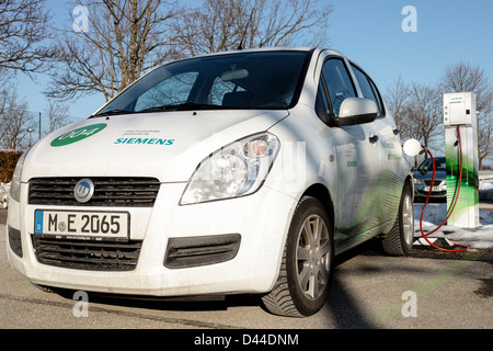 Siemens movE electric car (Suzuki Splash platform) being recharged at a Siemens charging station in Munich Stock Photo