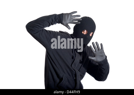 Catch the burglar concept, thief with balaclava caught, isolated on white background Stock Photo