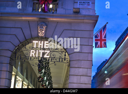 The Ritz  Hotel at Christmas  with Union Jack flag shoppers 