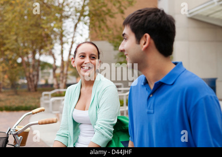 Smiling students talking on campus Stock Photo